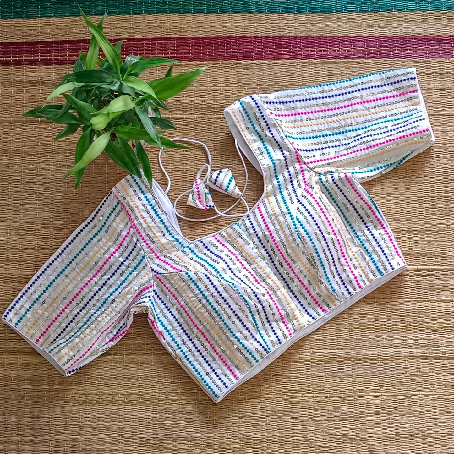 White multi color embroidery with sequence