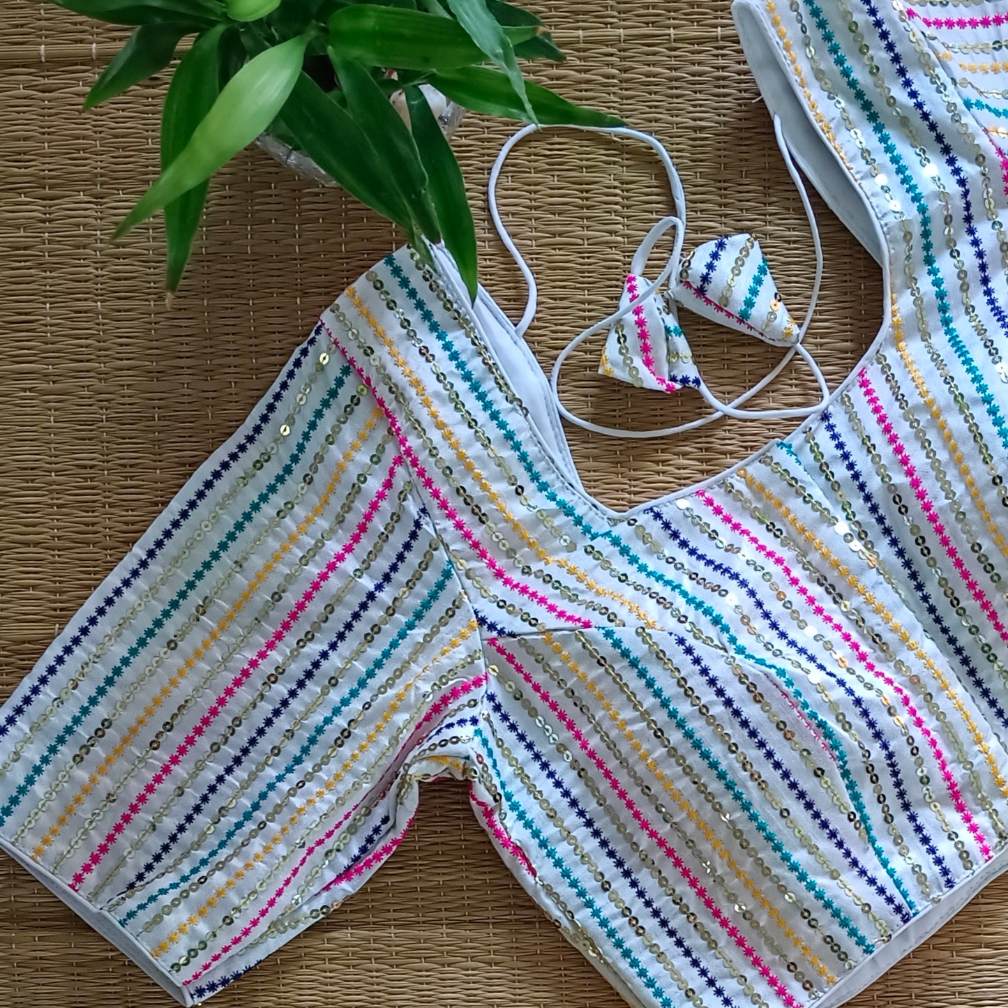 White multi color embroidery with sequence