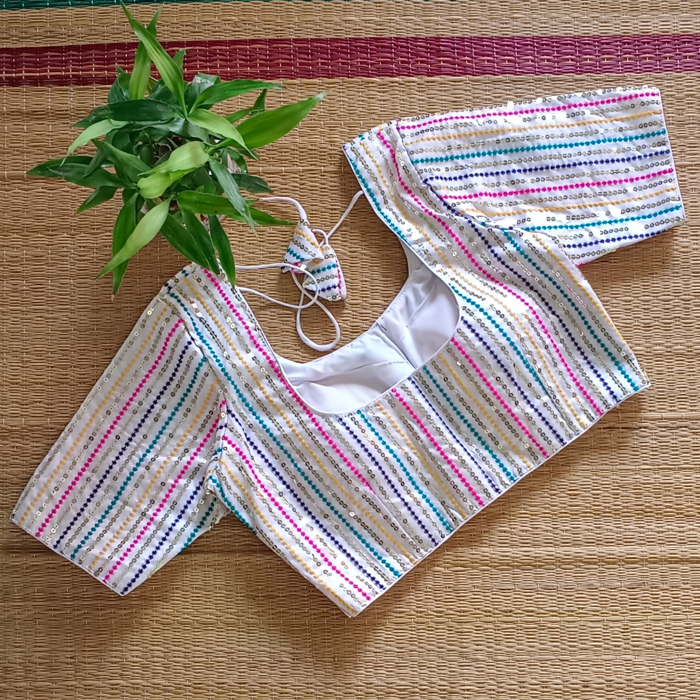 White multi color embroidery with sequence