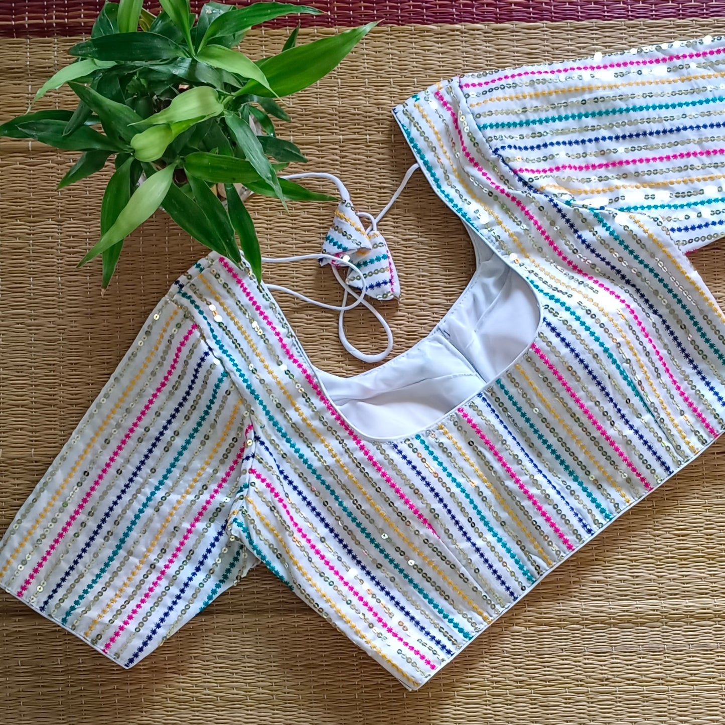 White multi color embroidery with sequence