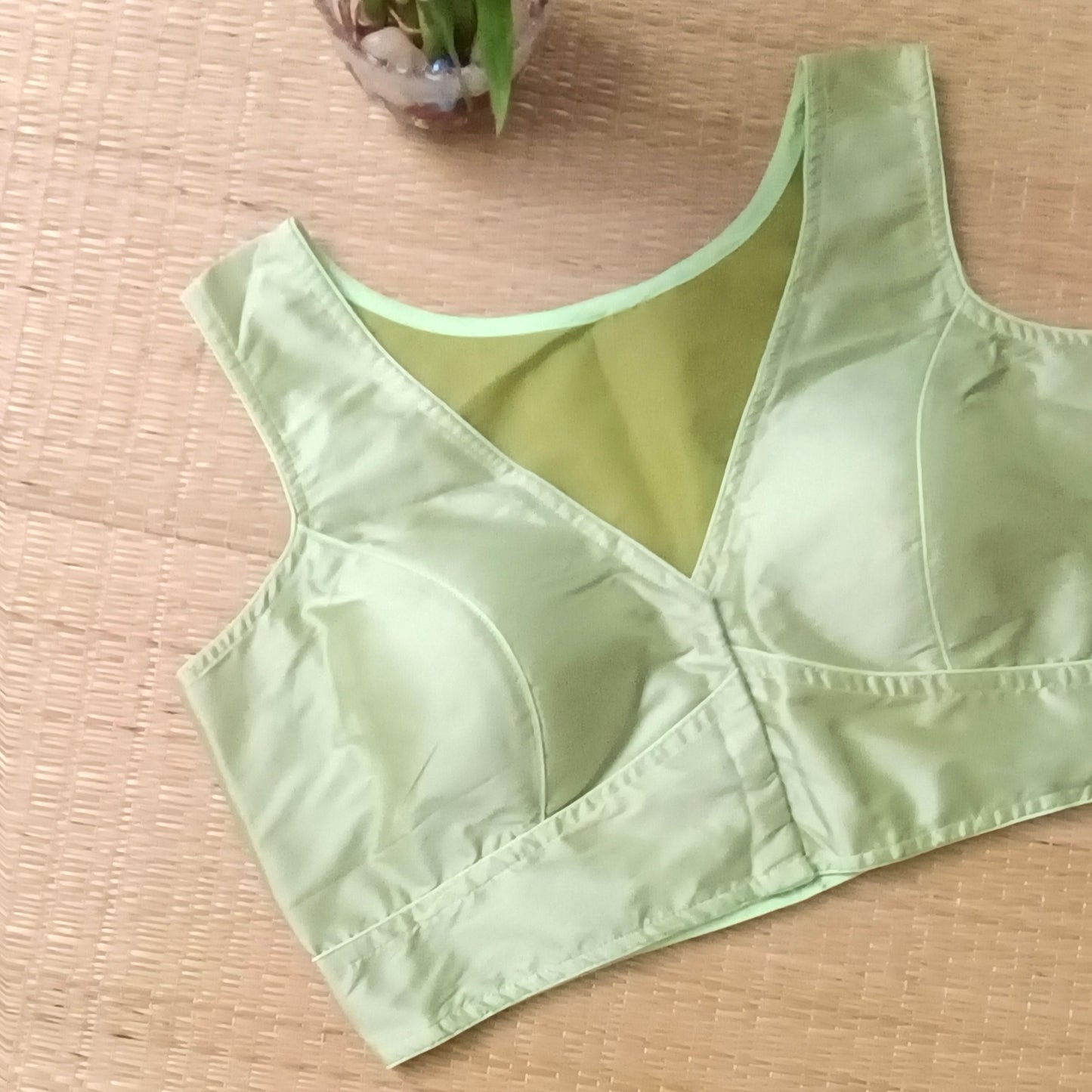 Pista green plain front V-neck sleeveless blouse