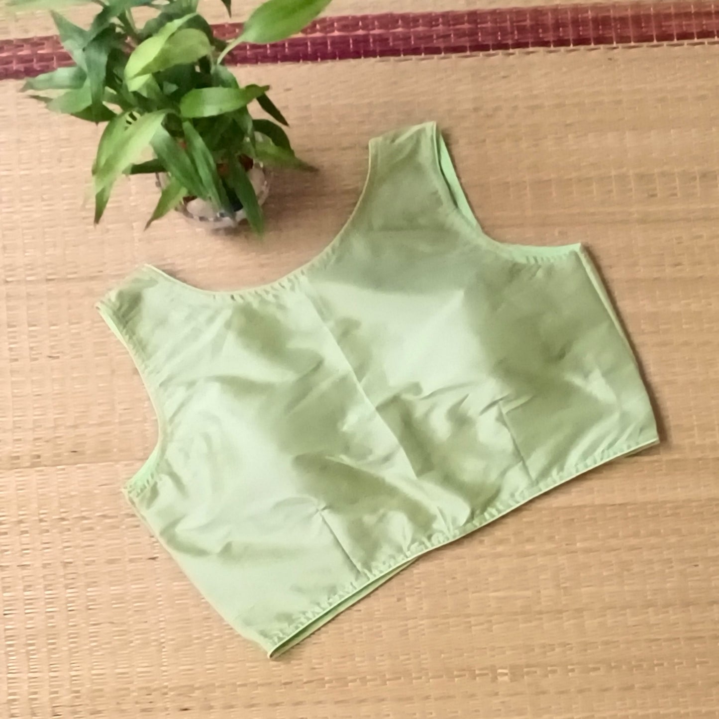 Pista green plain front V-neck sleeveless blouse