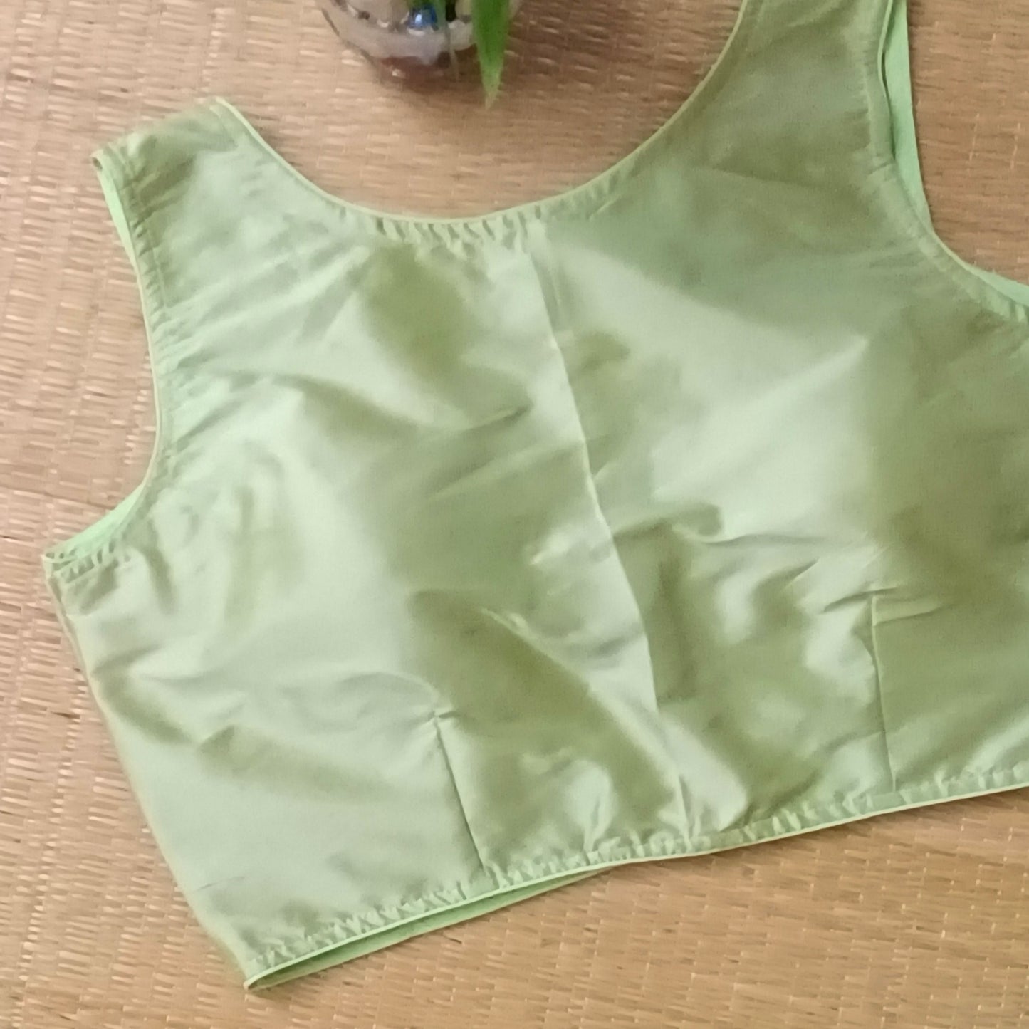 Pista green plain front V-neck sleeveless blouse