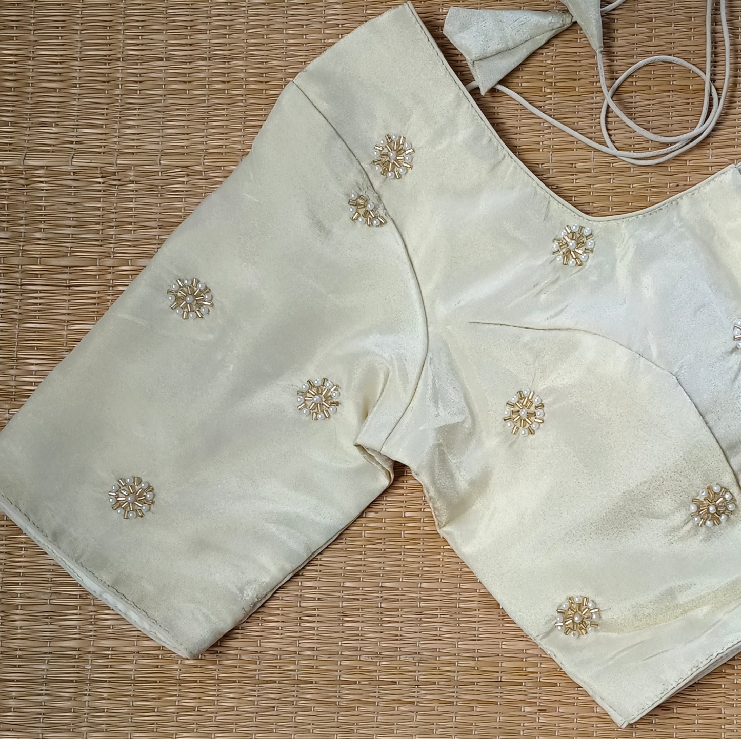 Light Golden Tissue blouse with pearl and cut dhana work( assorted )