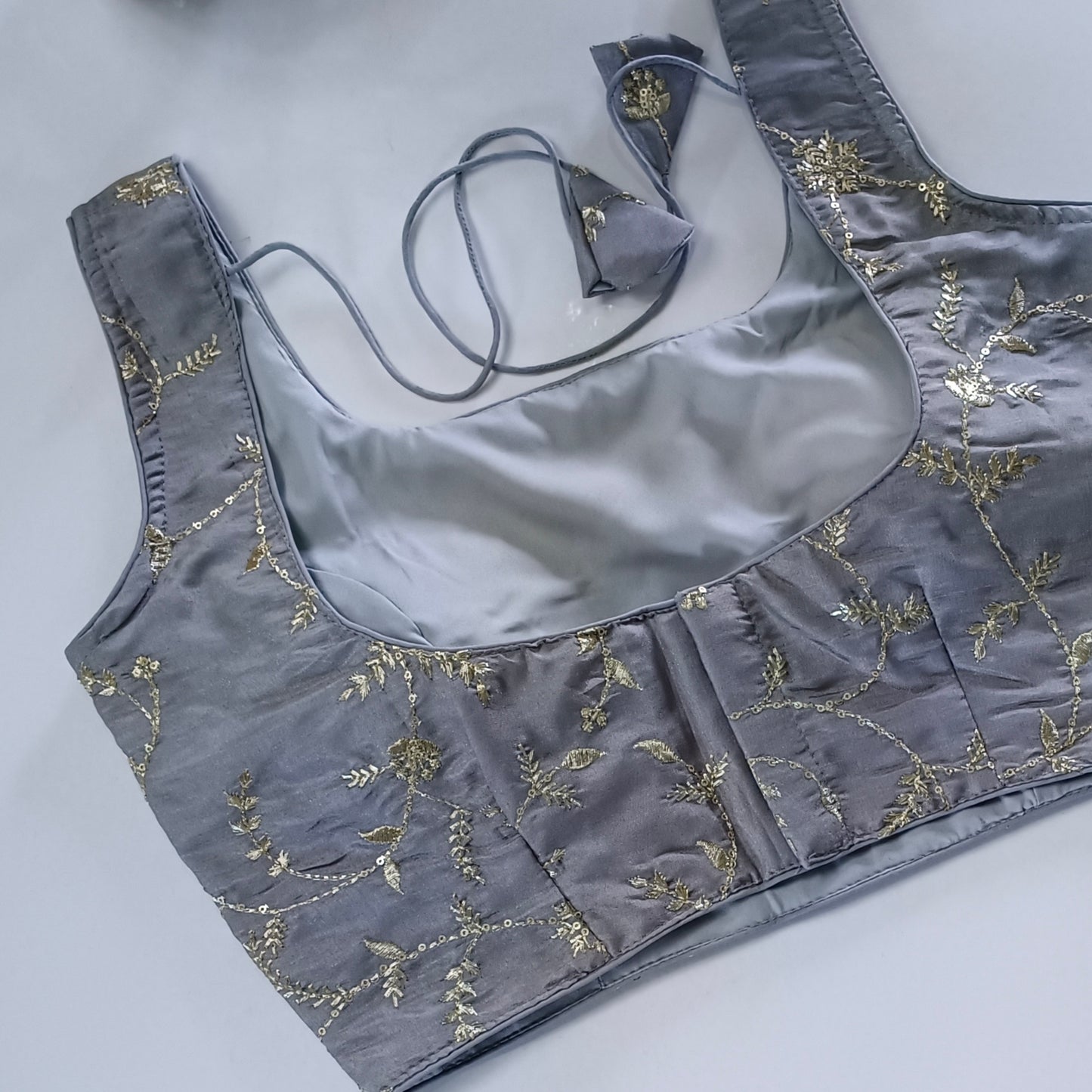 Grey tissue blouse with attachable sleeves