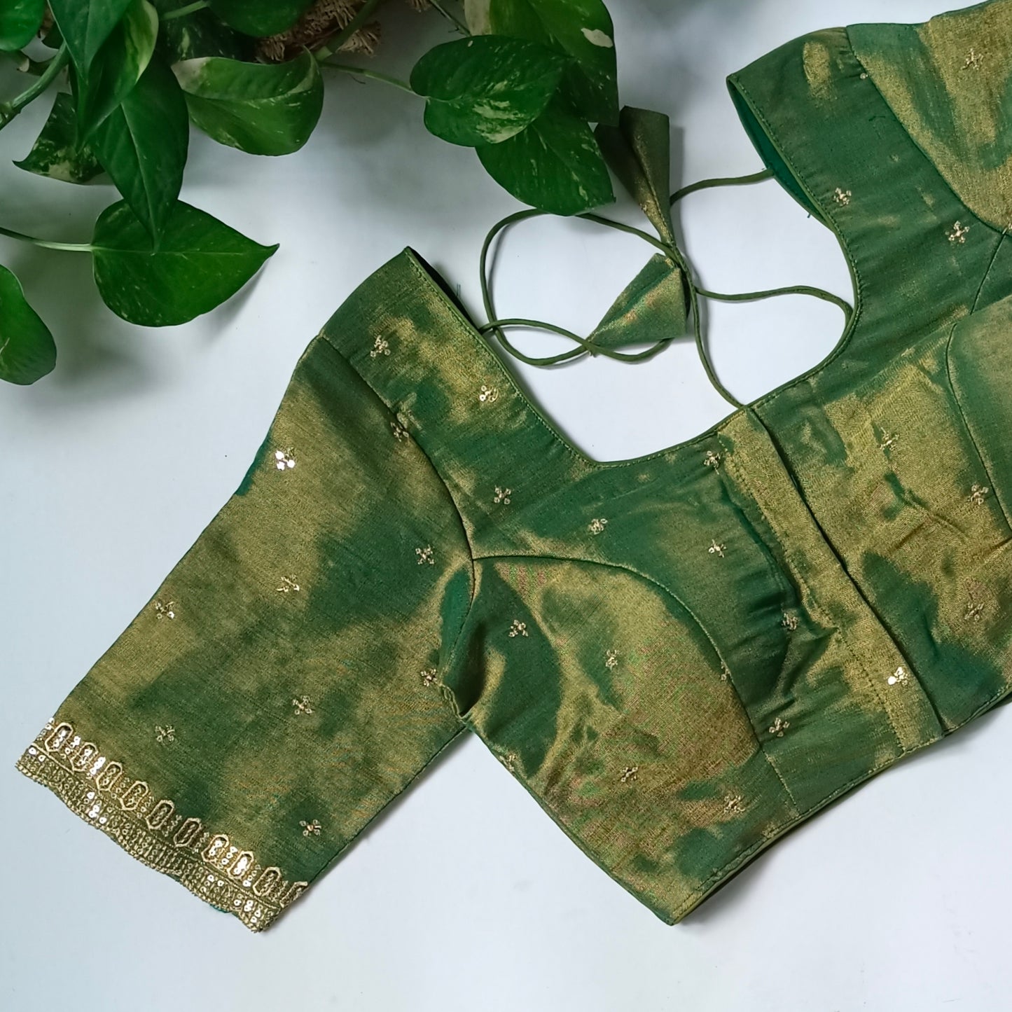 Green metallic tissue blouse with golden embroidery
