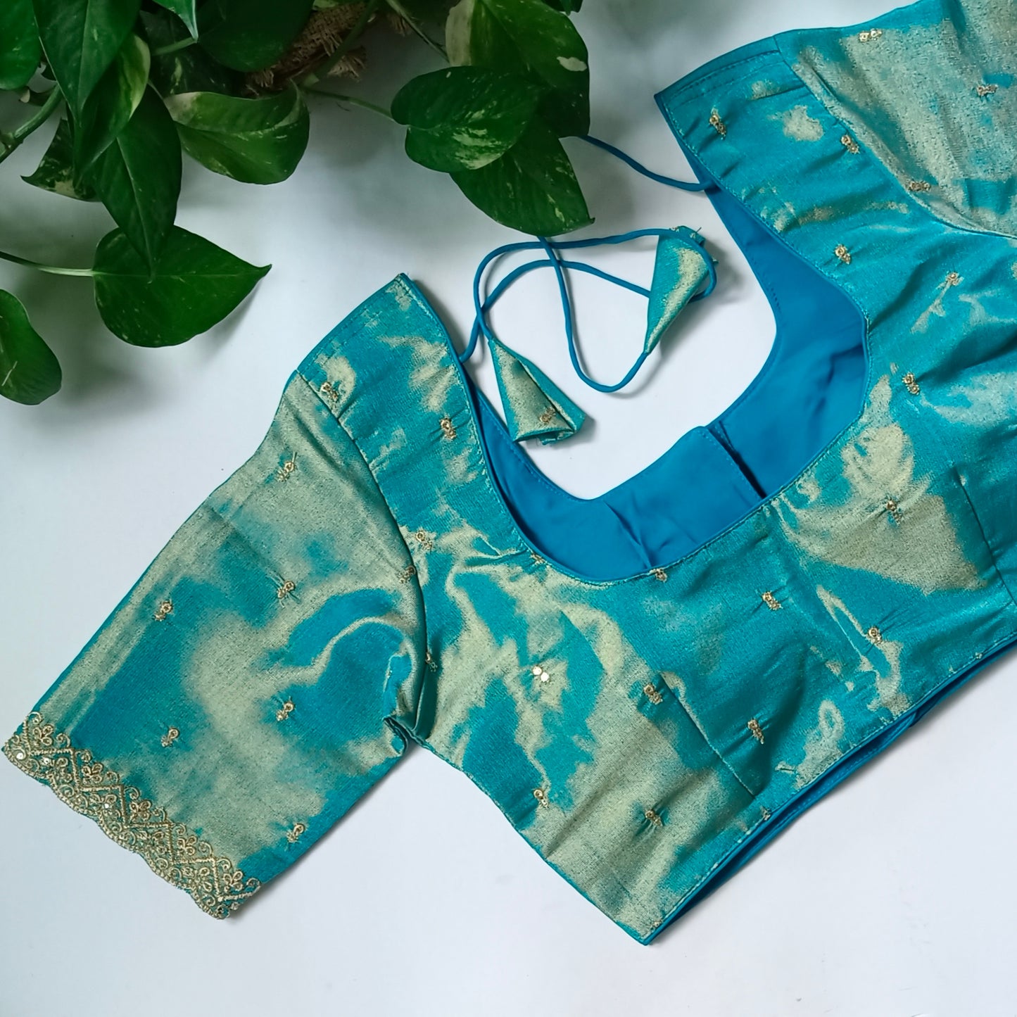 Blue metallic tissue blouse with golden embroidery