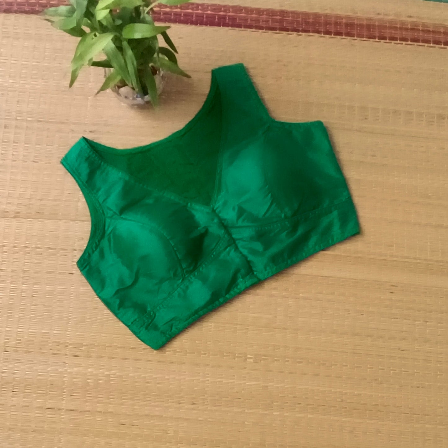 Green plain front V-neck sleeveless blouse