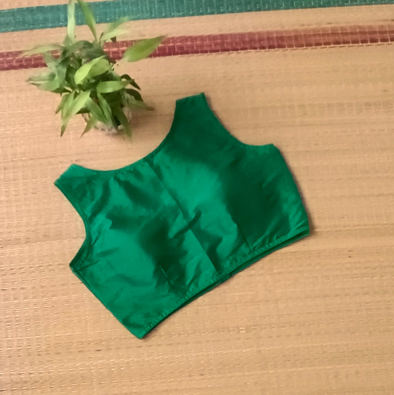 Green plain front V-neck sleeveless blouse