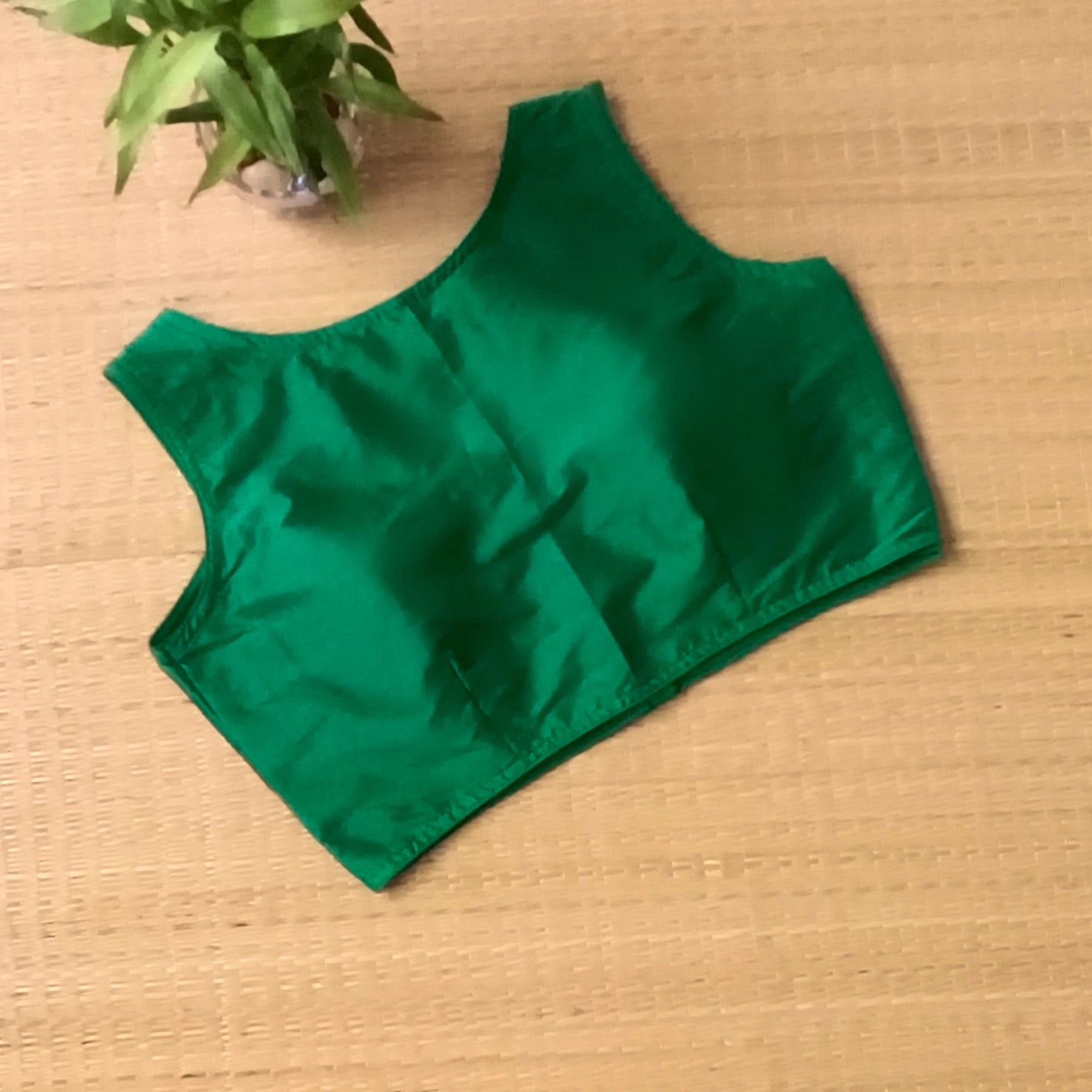 Green plain front V-neck sleeveless blouse