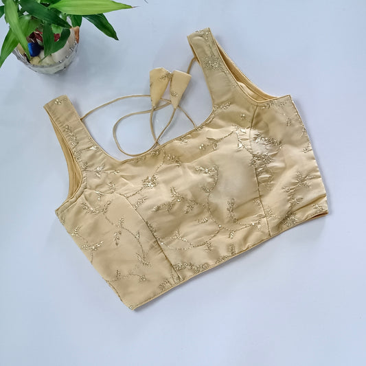 Golden tissue blouse with attachable sleeves