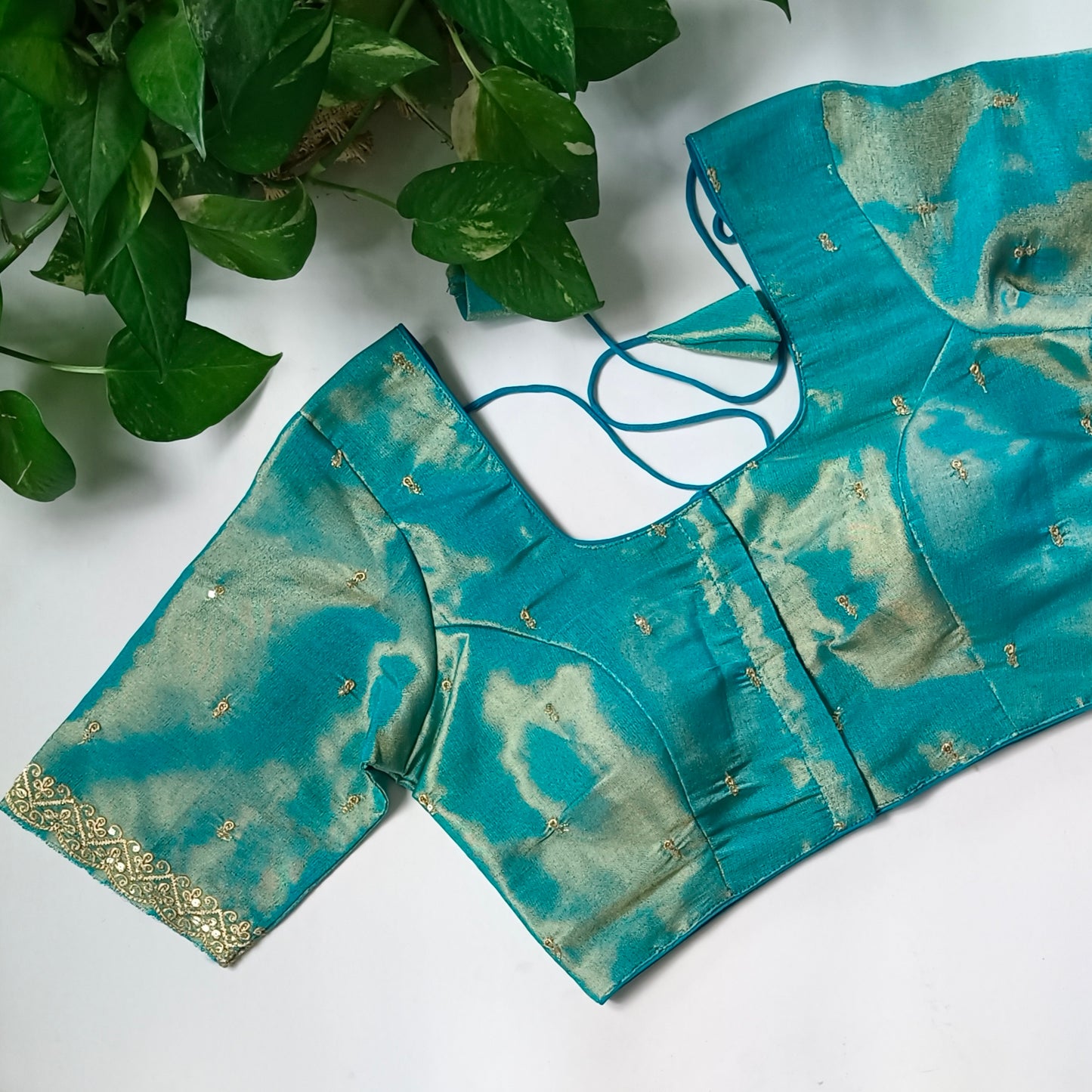 Blue metallic tissue blouse with golden embroidery